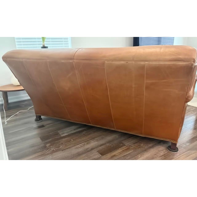 Hancock & Moore brown leather sofa, a timeless piece of American craftsmanship handcrafted in North Carolina. Upholstered...