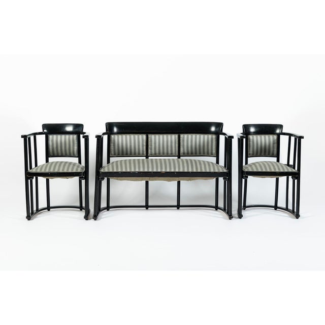 This antique Vienna Secession three piece bentwood salon set was likely made in Austria circa 1905. The set includes a...