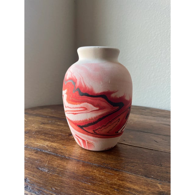 Nemadji Earth pottery vase. Red and Orange swirl design. No two potteries are alike. 5” widest diameter and 7” height No...