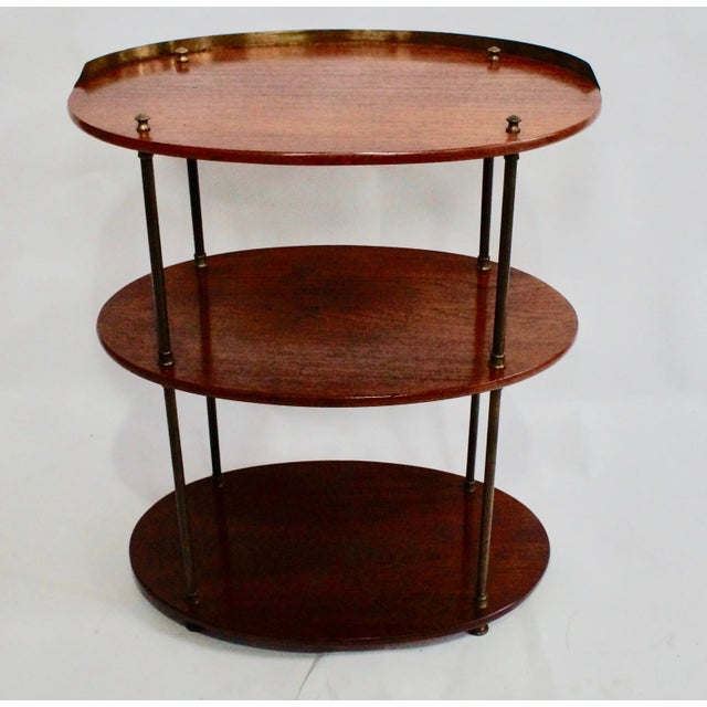 This beautiful 1830s campaign stand comes from the early 19thcCentury. It is made from mahogany and features 3 oval tiers...