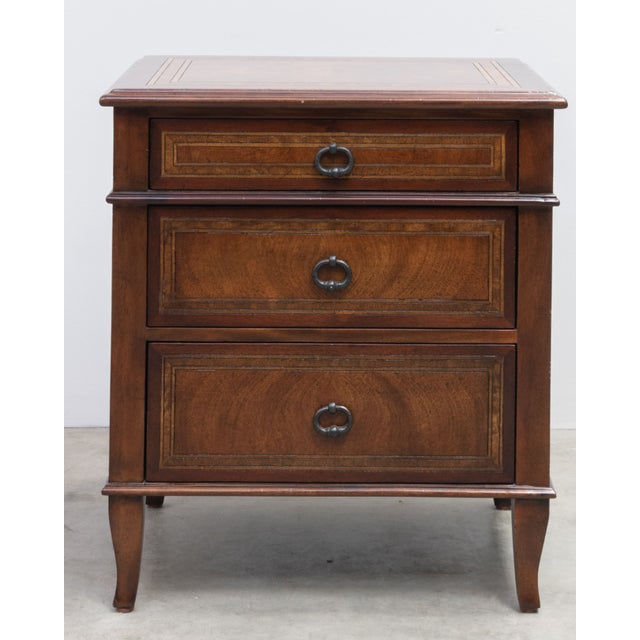 Nightstand with beautiful inlaid wood marquetry. A cerejeira veneered and Khaya nightstand, the rectangular cross banded...