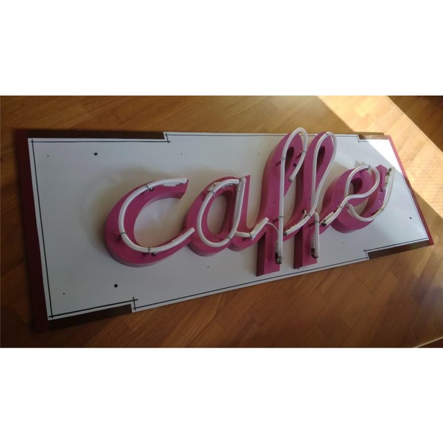 Elegant pink and white neon sign "Caffe" in a beautiful Italian script. Perfect statement piece for cafés, bistros,...