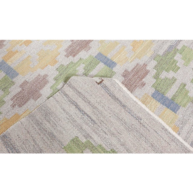 Swedish Flat Woven rug by Judith Johansson Size: 4'5" × 6'7" (134 × 200 cm) ​The vintage Swedish flat-weave rug by Judith...