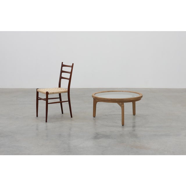 A refined modern table from late‑20th‑century Italy, combining the warmth of natural cedar wood with the clarity and...