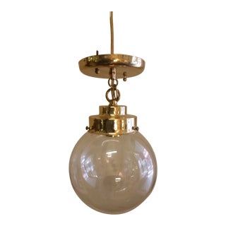 Modernist Brass Pendant Light With Smoke Glass Globe For Sale