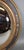 1990s French Oval Convex Butler’s Mirror in Black and Gilt For Sale - Image 4 of 4