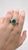 This stunning 2.22-carat GIA Certified Colombian emerald ring is a true statement piece, featuring a vibrant, deep green...
