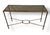 An elegant console table featuring a glass top and a two-tone steel and brass frame with X-stretcher base. Maison Jansen...