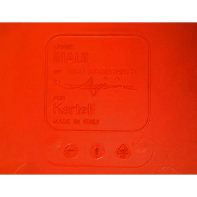 Pair of red molded plastic and chrome 'Maui' chairs. Made by Kartell, Italy. Original feet. Chairs stack for shipping.