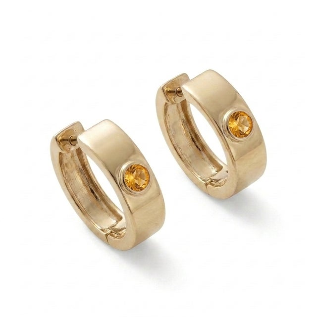 Infuse your everyday jewelry curation with a warm, joyful glow with these sophisticated and modern huggie hoop earrings....