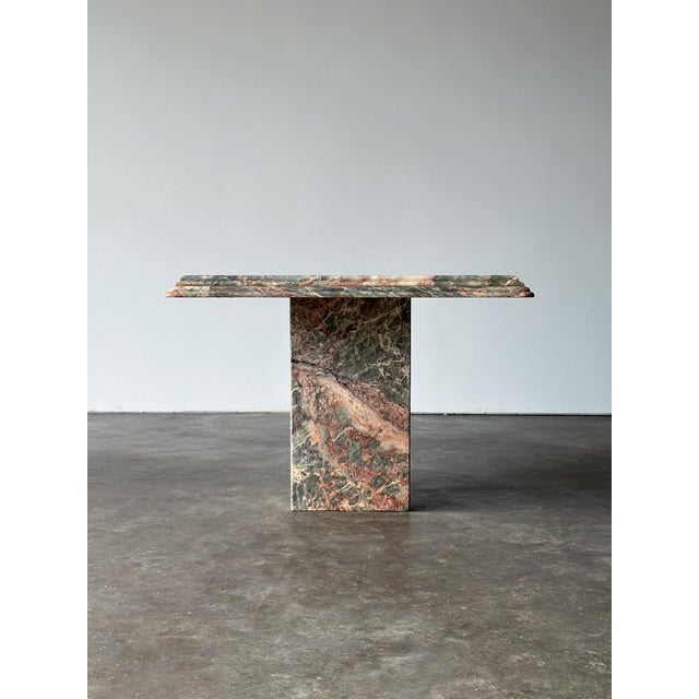 Cut from a single slab of Fior di Pesco marble, this vintage side table wears the stone's signature grey ground and soft...