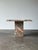 Cut from a single slab of Fior di Pesco marble, this vintage side table wears the stone's signature grey ground and soft...