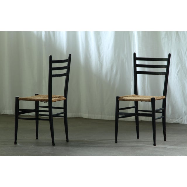 We present this set of four mid-century dining chairs from the esteemed Italian maker, Gessef Consorzio Sedie Friuli. This...