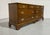 A traditional mid-century American-made dresser from the Hampton Court furniture line by Dixie Furniture.&nbsp;The solid...