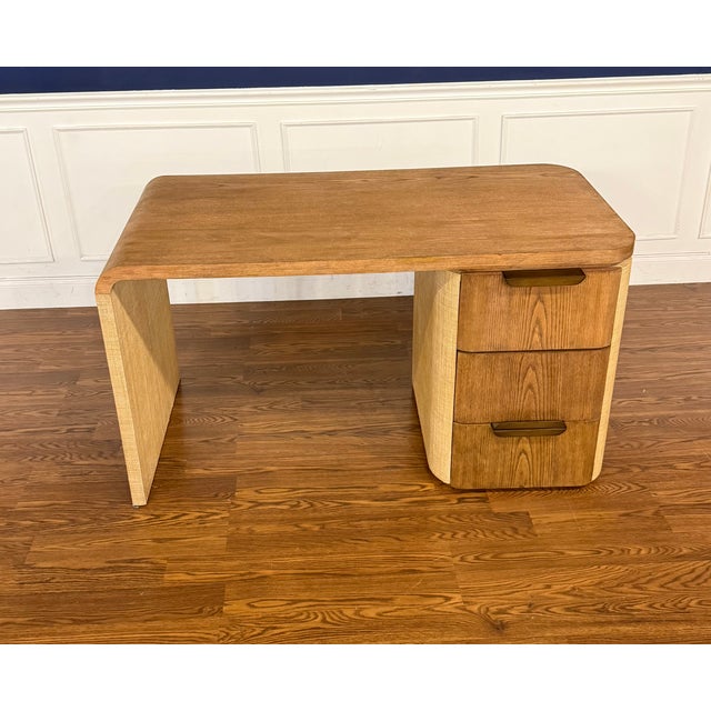 This is the Bohdi Desk by Century Furniture. It is crafted from raffia, Ash veneers and Ash solids. It features a softly...