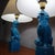 Elegant pair of vintage Chinese Foo Dog lamps, crafted from bright blue ceramic. These decorative lamps are inspired by...