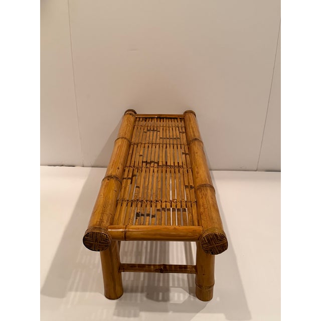Very chic beautifully made bamboo bench having a thick bamboo frame and sliced bamboo seat.