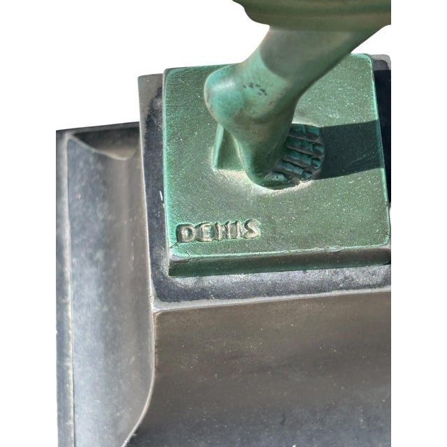 A beautiful and elegant patinated metal sculpture by Denis, circa 1930. Model "Folie," produced by Max Le Verrier. Green...