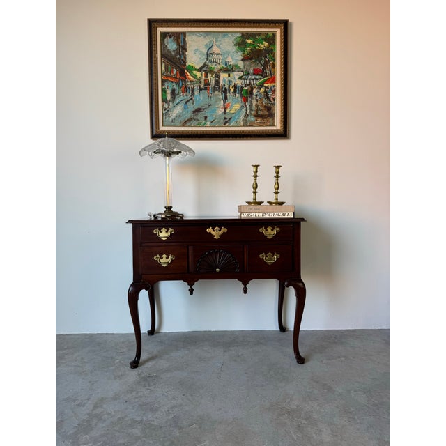 Elegant and finely crafted, this vintage Queen Anne–style lowboy dates to the 1970s and was produced by Councill Craftsmen...