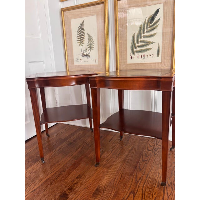 Absolutely beautiful pair of vintage early to mid 20th century letter top end tables with original leather tops and brass...