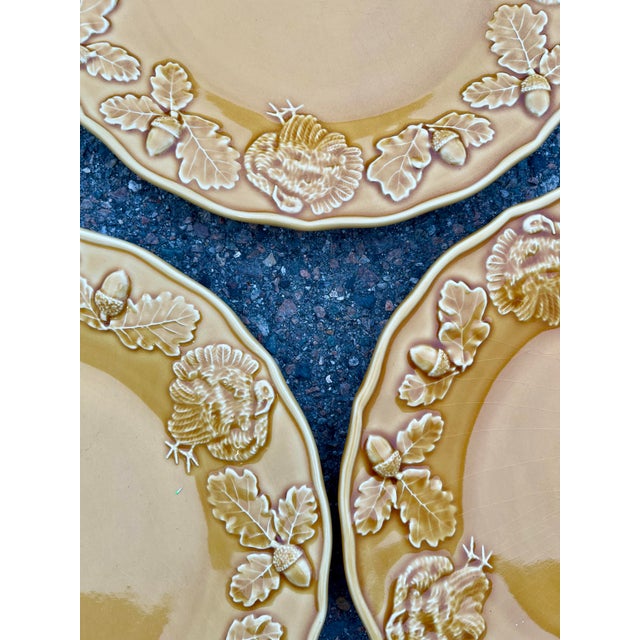 a set of 5 discontinued dinner plates from Bordallo Pinheiro of Portugal. Each comes in yellow and features a raised...