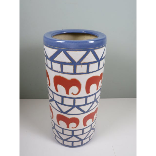 Large Italian ceramic umbrella stand from the 1960s, decorated with a bold rhythmic pattern of geometric blue bands and...