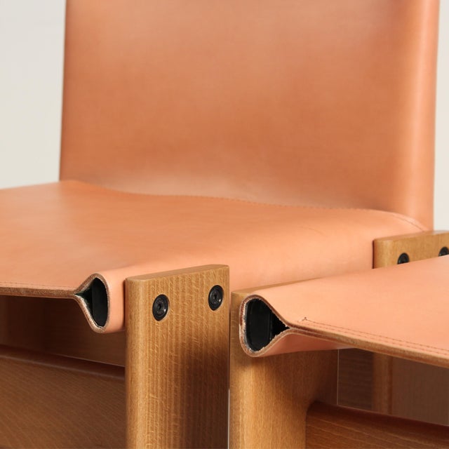 Set of eight “Monk” dining chairs designed by Afra & Tobia Scarpa and produced by Molteni in 1973. The Monk chair is one...
