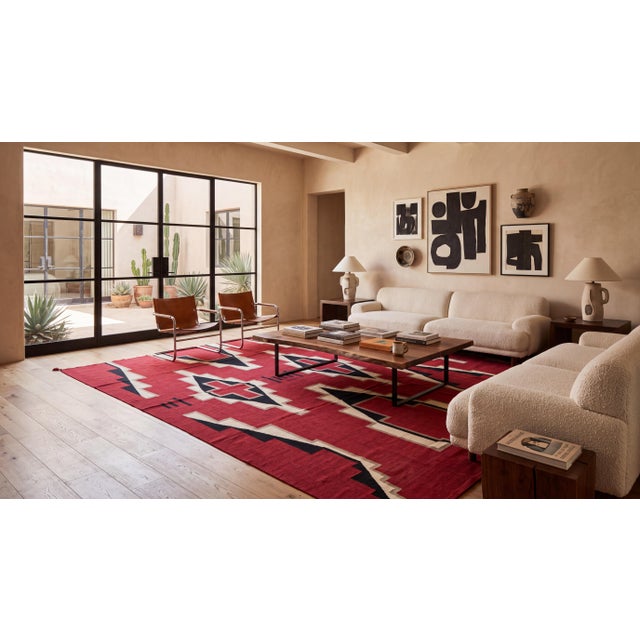 Elevate high-end interiors with this striking contemporary wool rug inspired by classic Southwest Navajo weaving...