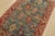 An authentic vintage tribal Heriz rug hand-knotted with fine wool on a cotton foundation. This rug features geometric...