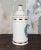 This 1988 ceramic apothecary jar looks to have been inspired by Jeanne Robinette for Rexall Drug Stores in the 1950s,...