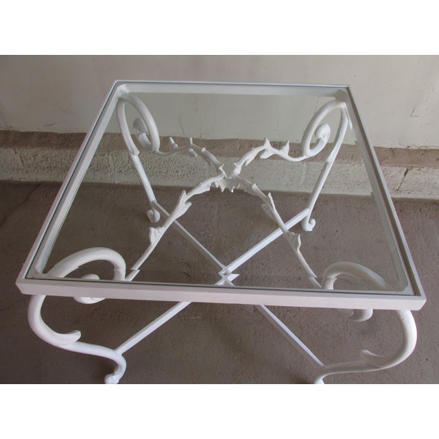 Vintage 1960s ornate painted aluminum side table with glass top in the style of Jean-Charles Moreux. Features cabriole...