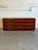 This exceptional lowboy silhouette features soft rounded corner edges and a seamless handleless front. Nine deep...
