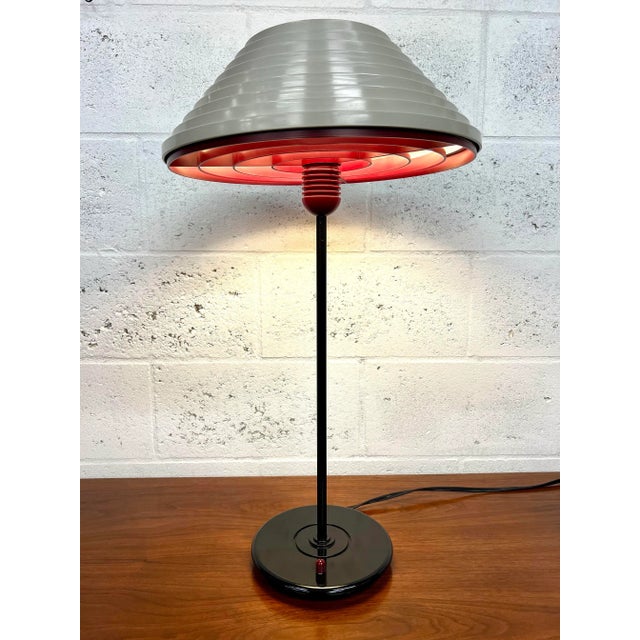 Vintage Herman Miller desk/table lamp. It is labeled Model # G6310 on the bottom. The switch matches the burgundy...