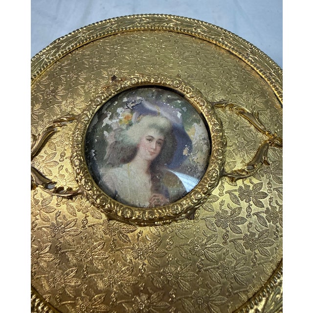 This antique Victorian ormolu bronze and colorless crystal vanity powder box is a handmade piece originating from France....