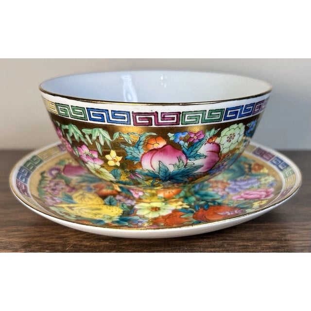 This is a Vintage Chinese Zhongguo Chao Cai Mille Fleur Porcelain Tea Bowl and Saucer Set. The tea bowl measures 2 3/8”...