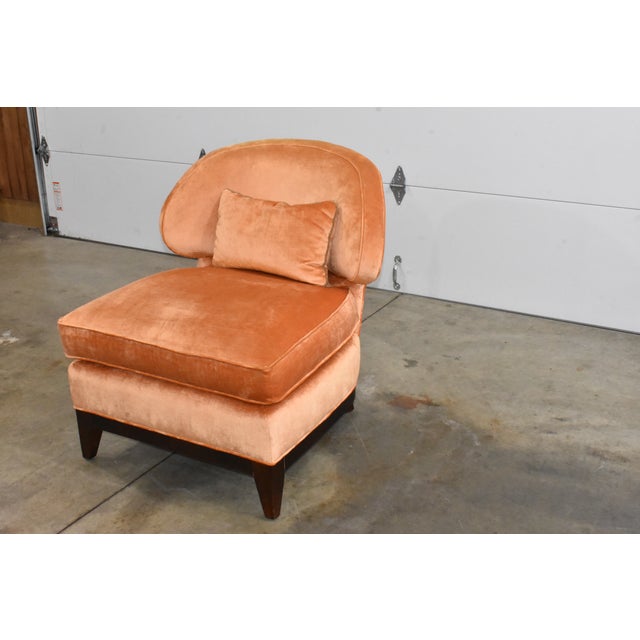 Awesome slipper chair made by Century Furniture Co. It is orange or peach in color depending on how the light is hitting...