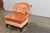 Awesome slipper chair made by Century Furniture Co. It is orange or peach in color depending on how the light is hitting...