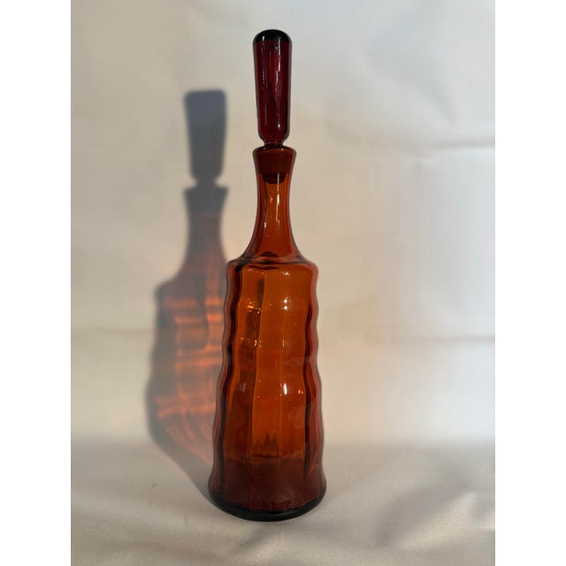 Vintage Blenko Glass Honey Decanter, specifically the #658S model. Designed by Joel Myers, it was first released in 1965....