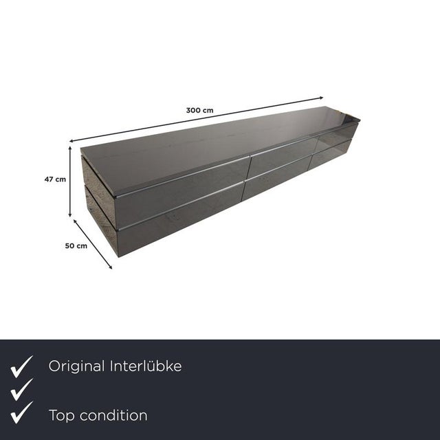 This high-quality interlübke Cube TV stand in elegant gray impresses with its clean lines, premium materials, and ample...