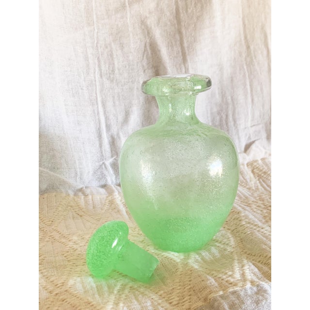 This adorable vase has great weight to it, and has the original matching stopper. It has a pontil mark on the bottom to...
