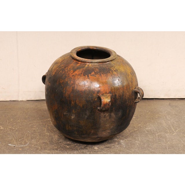 A larger-sized Guatemalan clay pot with beautiful glazed finish. This vintage cooking vessel has been made of clay, has a...