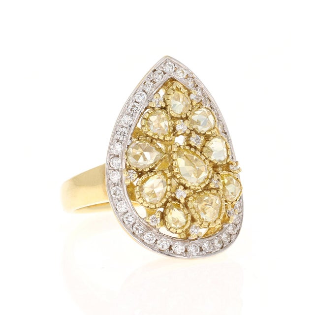 This ring has Natural Pear Cut Yellow Diamonds that weigh 1.75 carats and also Natural Round Cut White Diamonds that weigh...