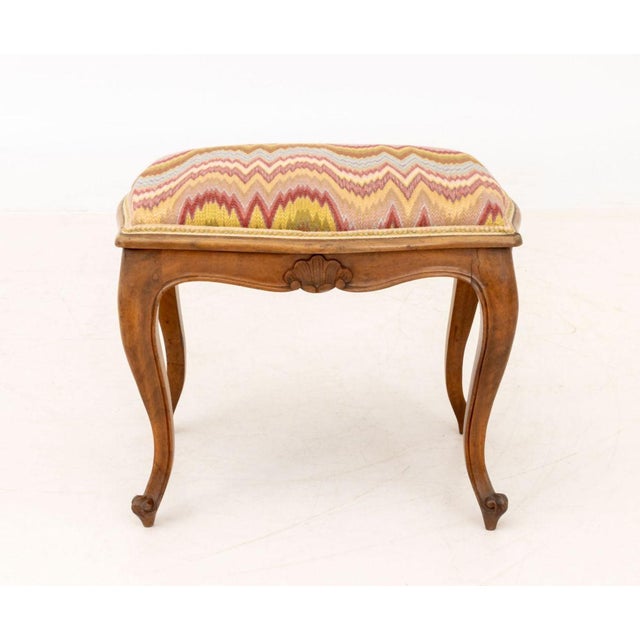 Louis XV Style Flame Stitch Upholstered Stool, with shell carving and four cabriole legs, paper label to underside. 17" H...