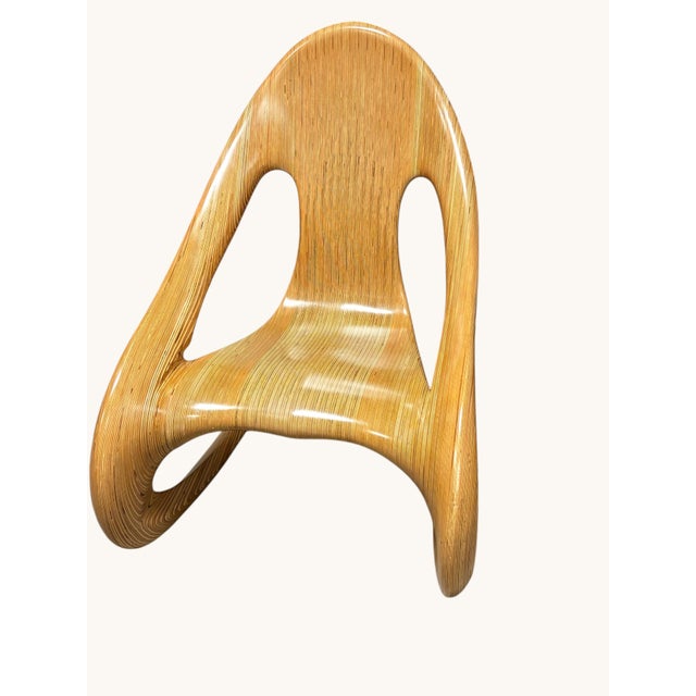 Modern Rocking Chair. Signed "Carl Gromoll 1983". The Rocker is handcrafted of stacked, laminated, carved and polished...