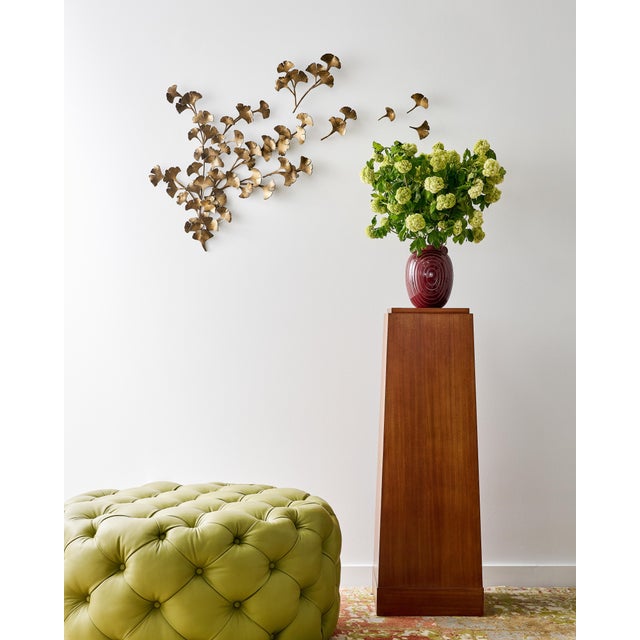 Ginkgo leaves a line on intricate, hand-crafted branches and seems to float through the air in our latest wall decor...