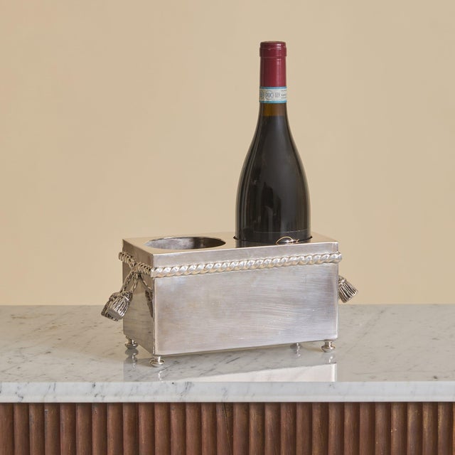 A 20th century French silver-plated wine chiller. The rectangular form is elevated on petite bun feet, its polished...