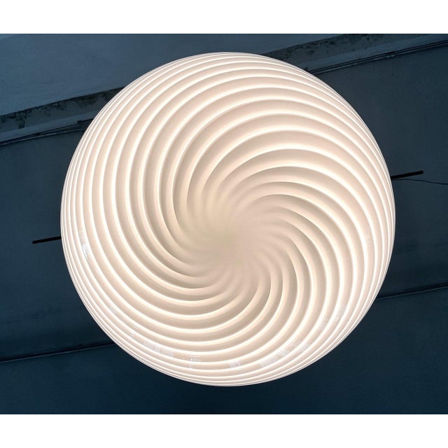 Beautiful and elegant original Murano globe pendant lamp in white colored swirl glass with brass details. Made in Italy in...