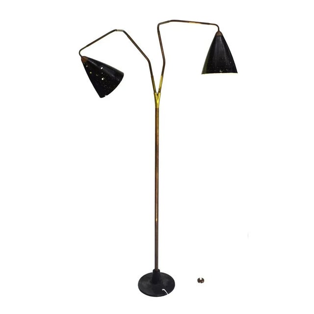 Iconic floor lamp; its functional principle was first presented at the Milan Triennale in 1951. A very rare and important...
