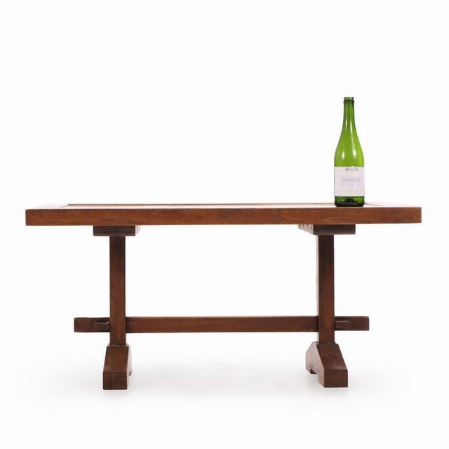 This wonderful trestle form coffee table has a touch of the Brutalist thanks to the raw, unpolished appearance of the...