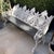 Cast Aluminum Four Seat Garden Bench, 20th c., with four pierced medallion backs over a slatted wood seat, flanked by...